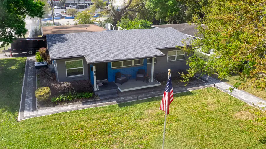 Aerial photo of a finished gray architectural shingle roof on a single story home