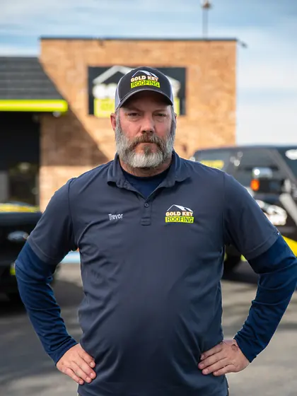 Gold Key Roofing team member outside the office