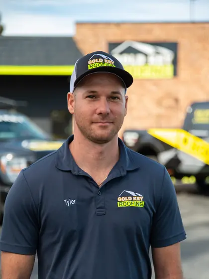 Gold Key Roofing team member outside the office