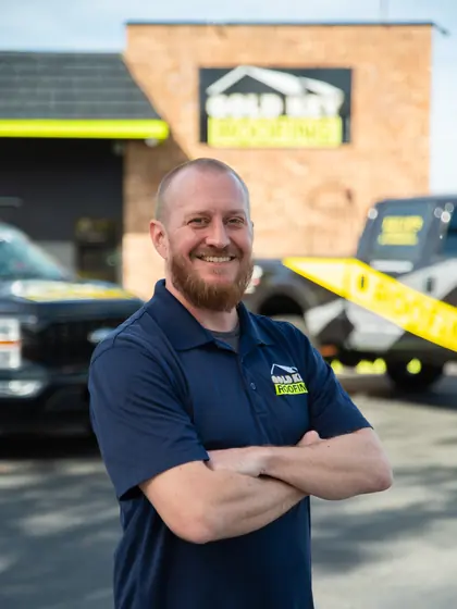 Gold Key Roofing team member outside the office