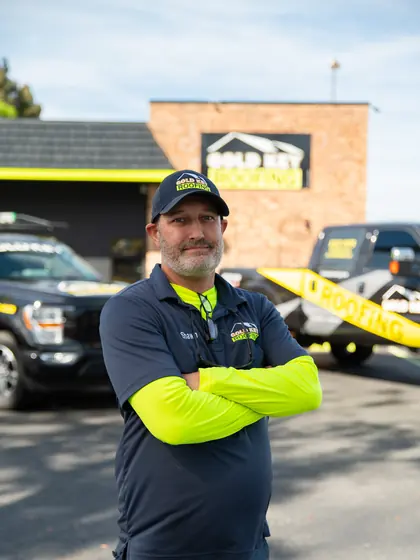 Gold Key Roofing team member outside the office