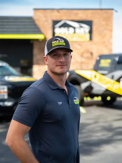 Gold Key Roofing team member outside the office