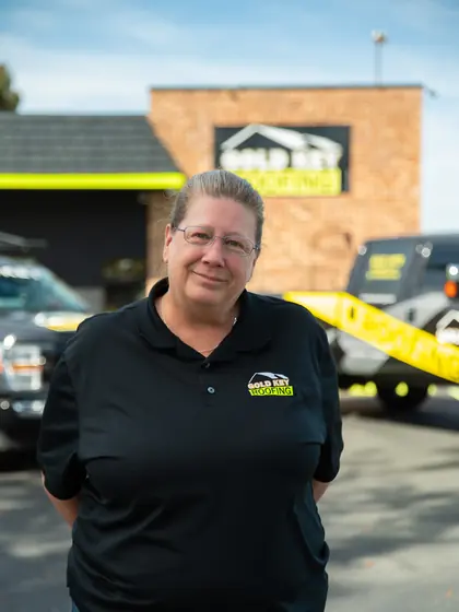 Gold Key Roofing team member outside the office