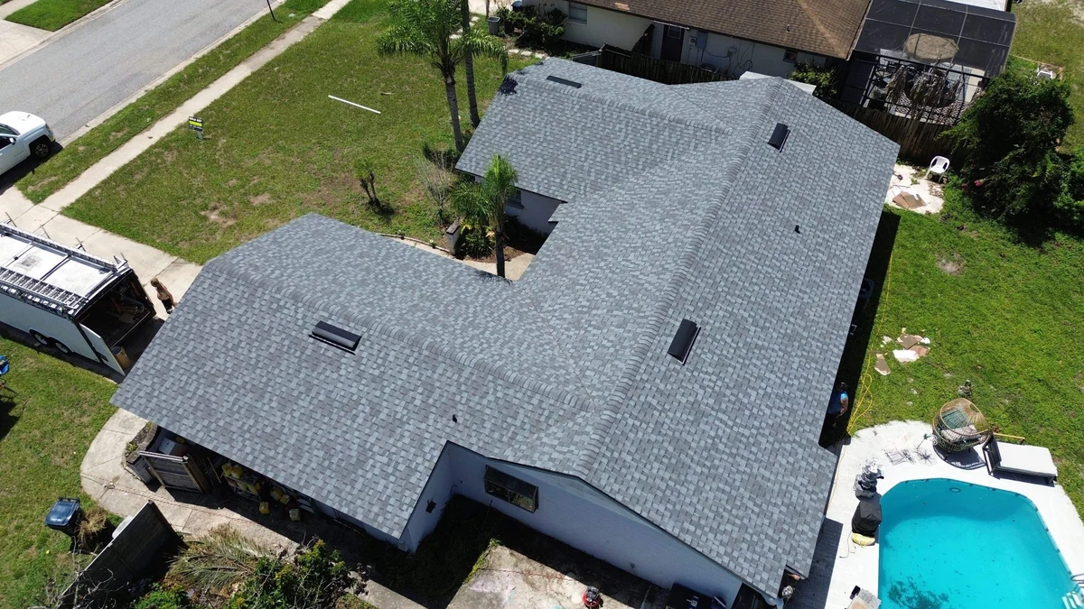 Aerial view of a completed architectural shingle roof installed by Gold Key Roofing in Orlando